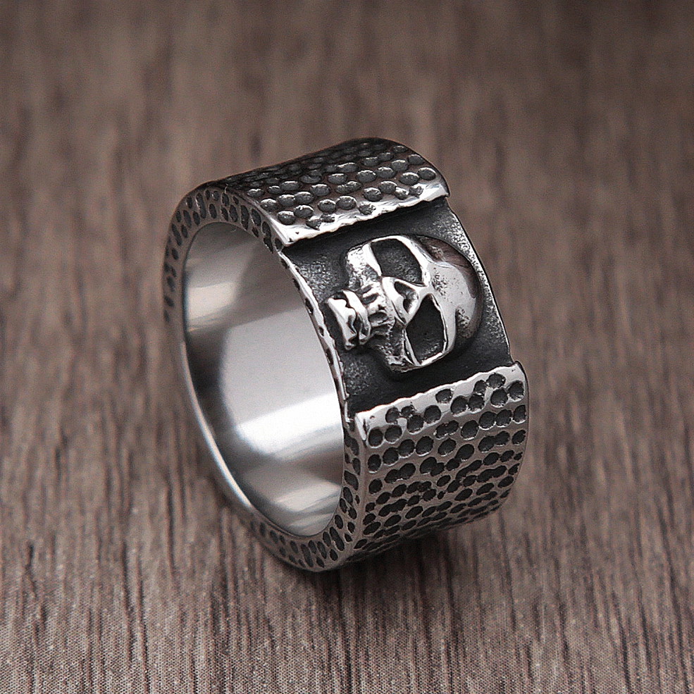 Profile skull stainless steel ring oblique view with polished inner band and side skull details