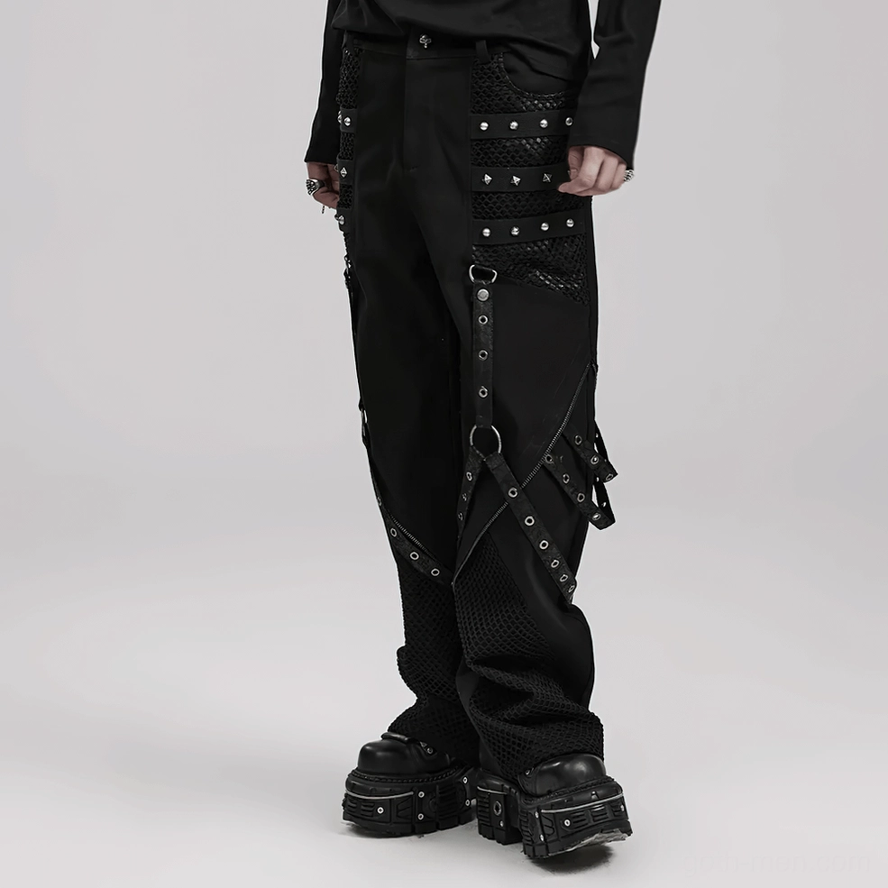 Angled view of studded mesh gothic pants highlighting layered fabric construction and texture