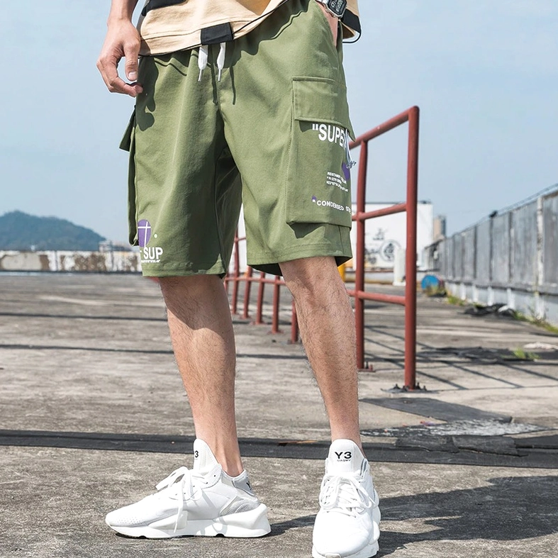Army green gothic shorts showing utilitarian pocket layout and fit dimensions