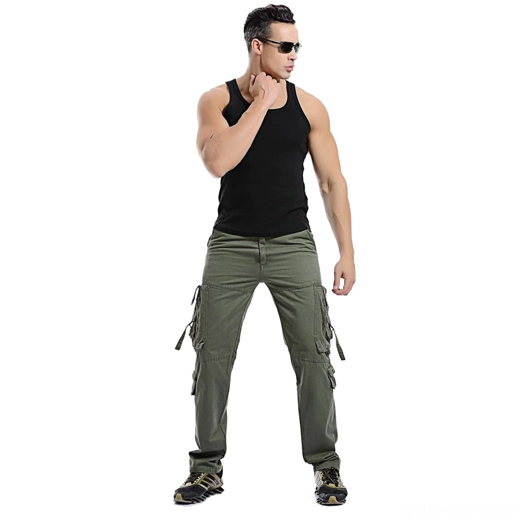 Model wearing army green tactical cargo pants front view with tactical footwear and sunglasses