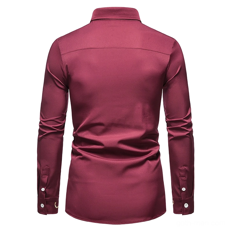 Asymmetric gothic shirt cuff detail showing embroidered trim and button construction