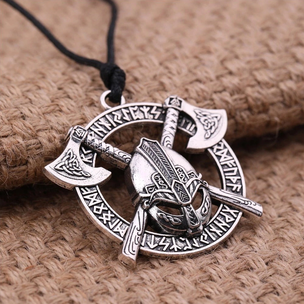 Norse warrior pendant with detailed rune engravings on natural burlap background