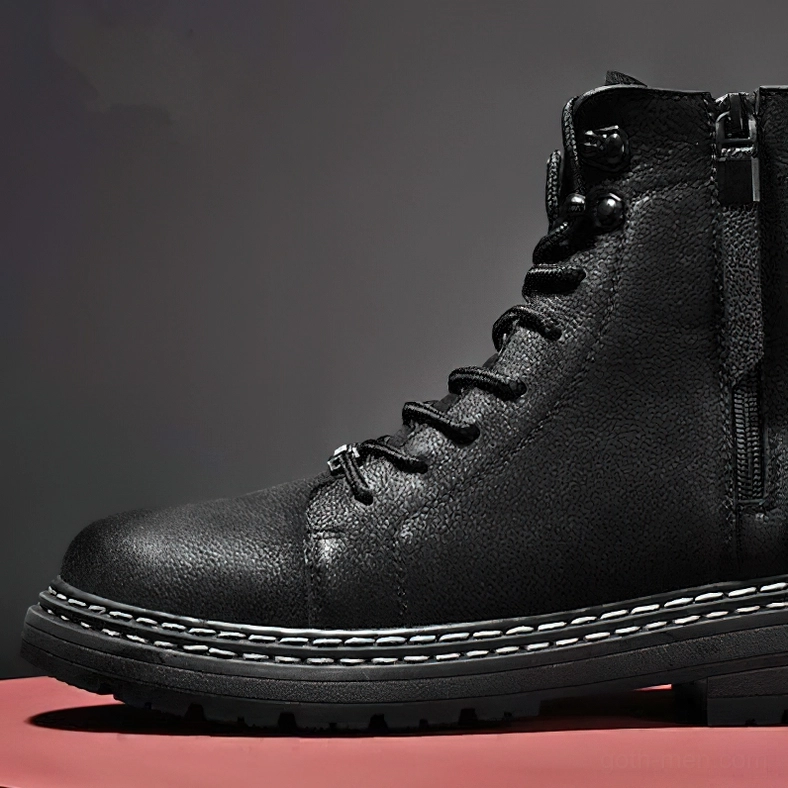Black leather ankle boots detailed view showing polished finish and premium cow leather quality