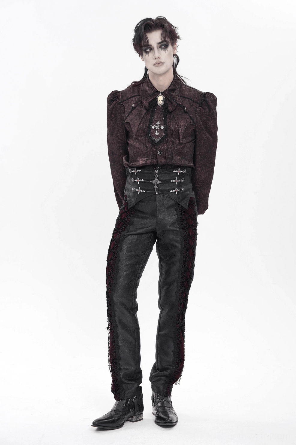 Front full view of black brocade gothic waist corset with prominent silver cross pendant and zipper hardware on white background