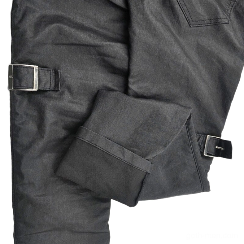 Black gothic motorcycle cargo pants fabric close-up - woven polyester cotton blend texture, adjustable side buckles, reinforced seams