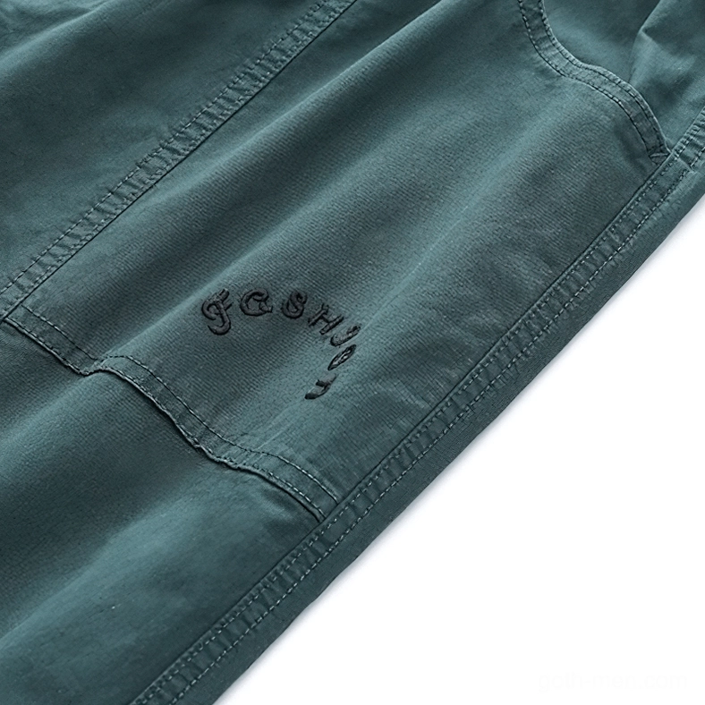 Black gothic harem cargo pants pocket detail showing functional zippered side pocket construction