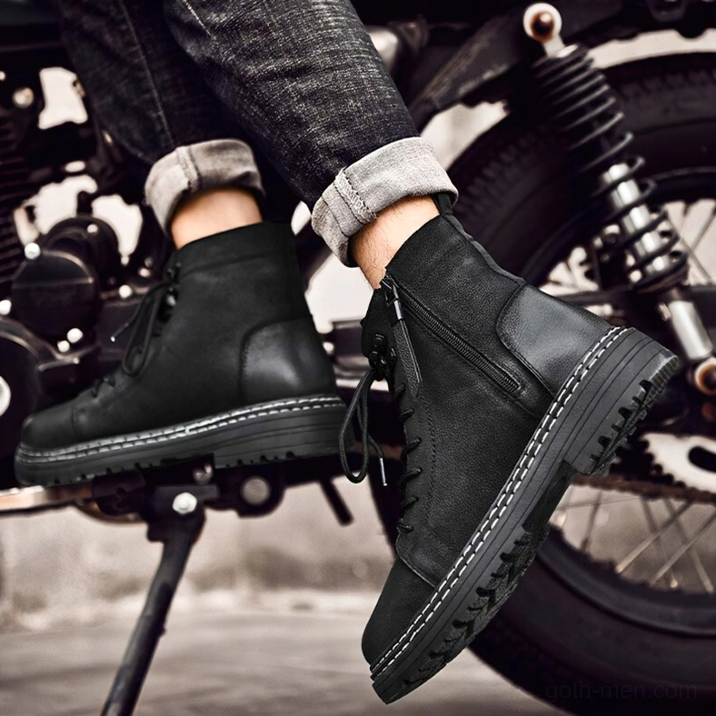 Side view of black leather combat boots with metal lace hooks and structured ankle support