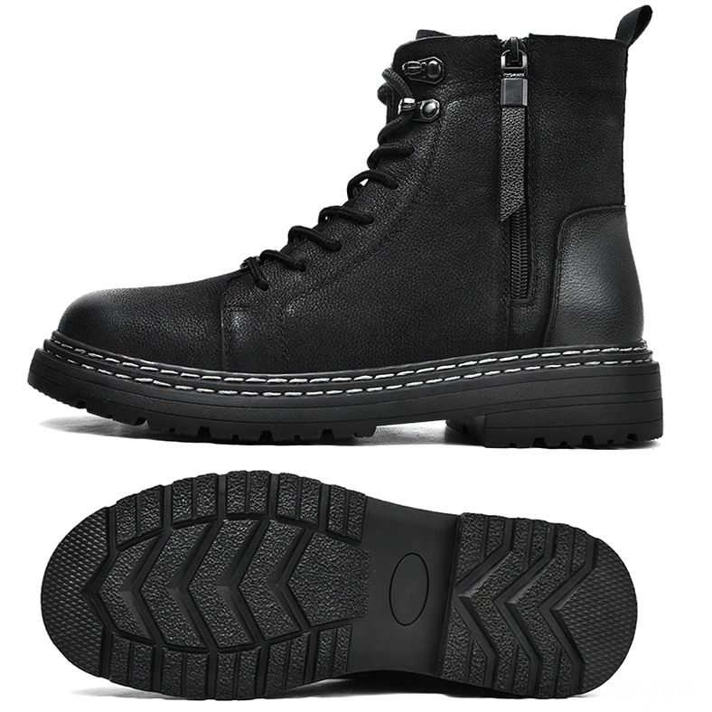 Men's black ankle boots profile view showing metal eyelets, thick lug sole, and heel pull tab