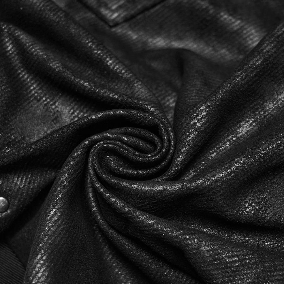 Black distressed gothic slim pants fabric texture showing mottled print and intentional fading