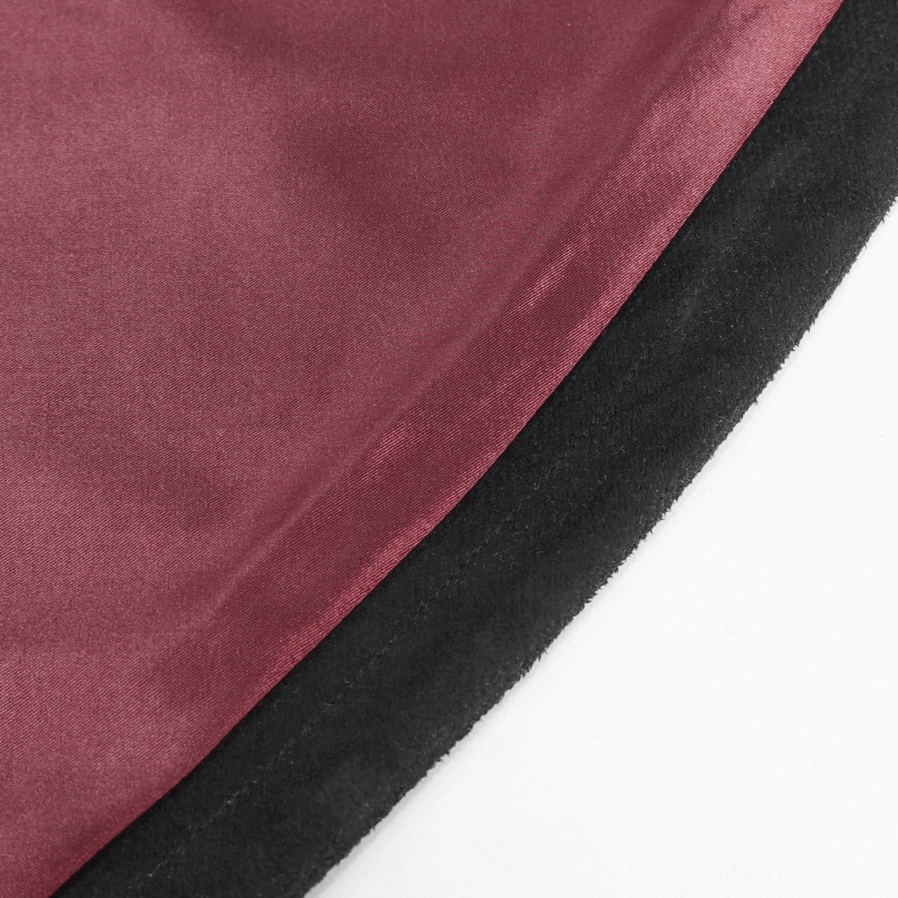 Full-length front view of black feathered asymmetric gothic cape displaying wine-red lining and theatrical silhouette