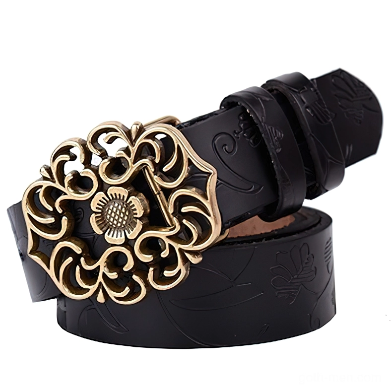 Black leather gothic women's belt coiled with embossed floral details and ornate bronze buckle, three-quarter perspective