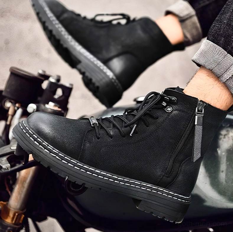 Back view of black gothic combat boots highlighting heel pull tab and structural support