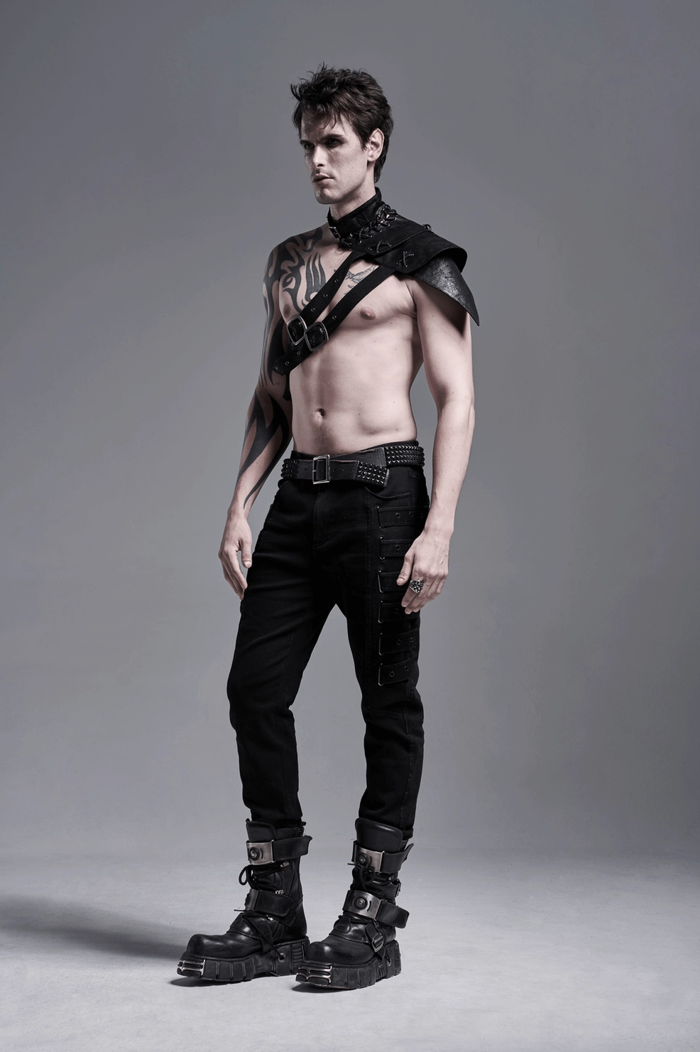 Black fitted gothic cargo trousers showcasing tapered silhouette and multi-row strap system