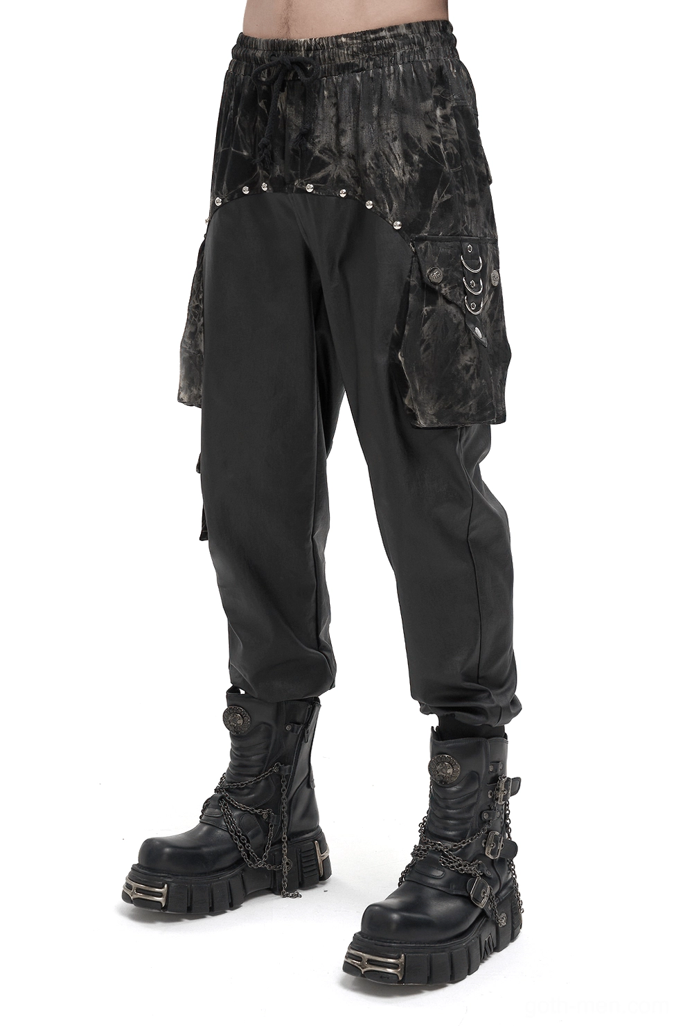 Black gothic cargo joggers with tie-dye splice and rivet hardware worn by male model, front side view
