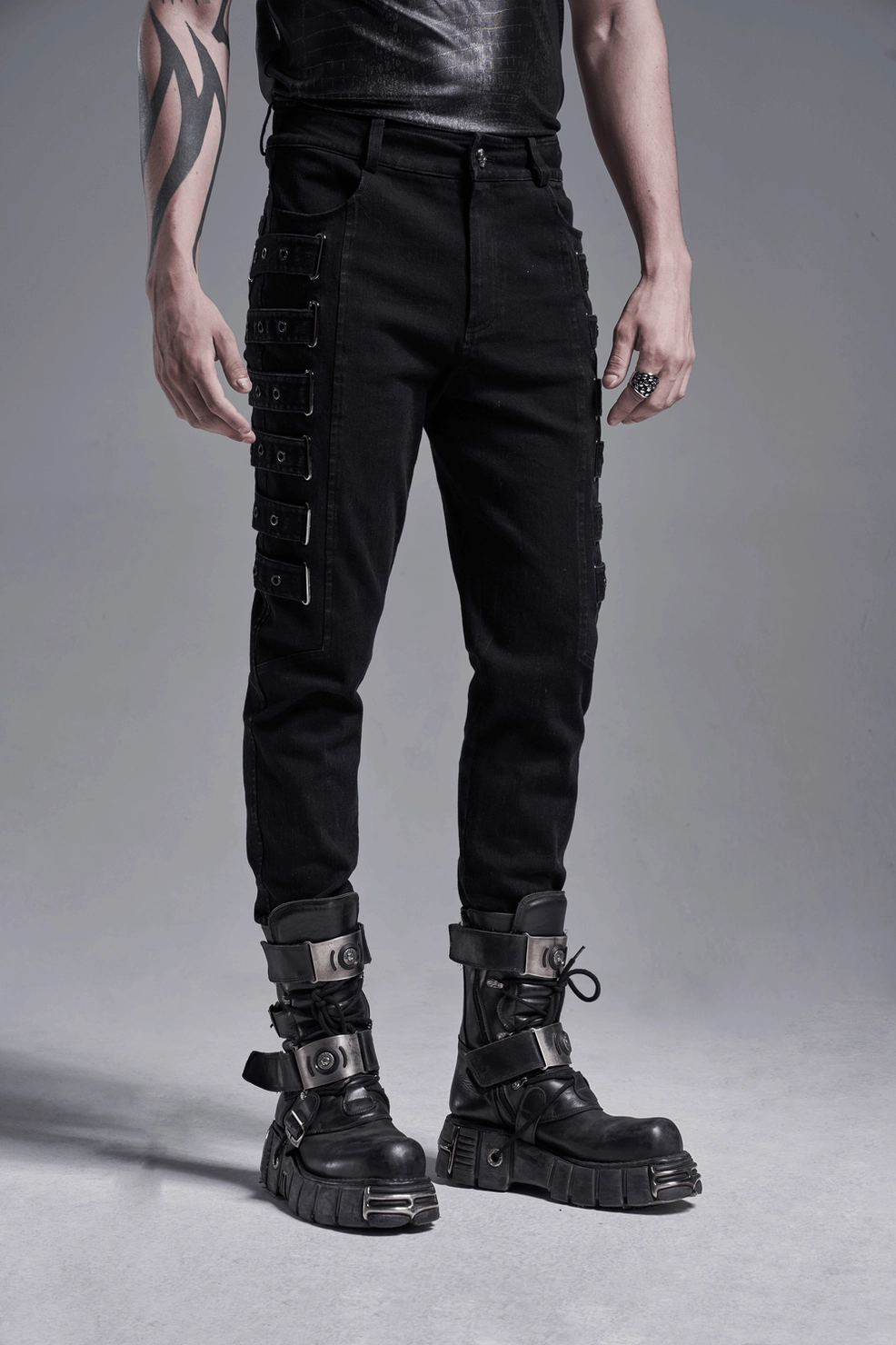 Black gothic cargo pants with side strap details and fitted contemporary silhouette styling view