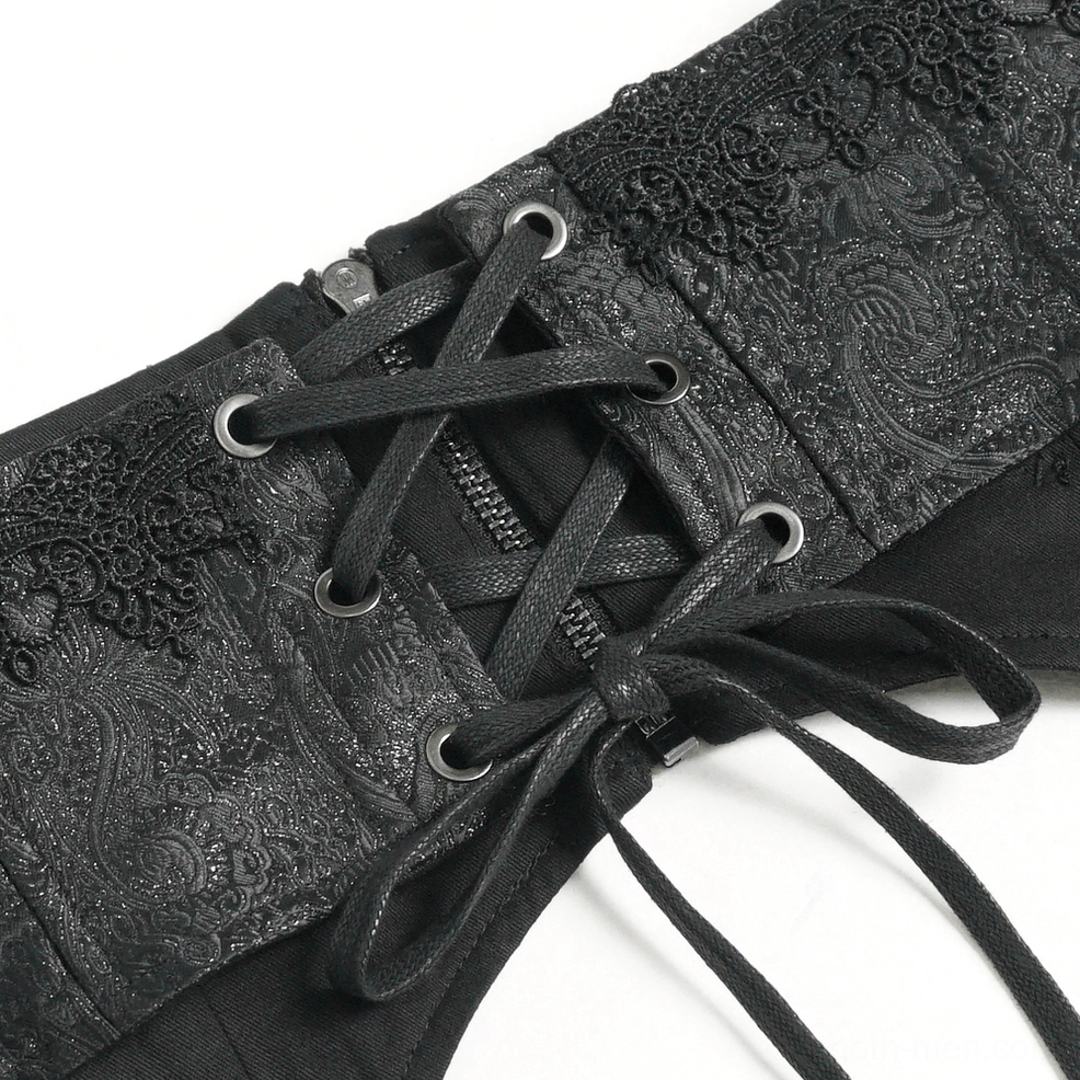 Brocade texture and embossed pattern detail of black gothic corset belt showing material quality