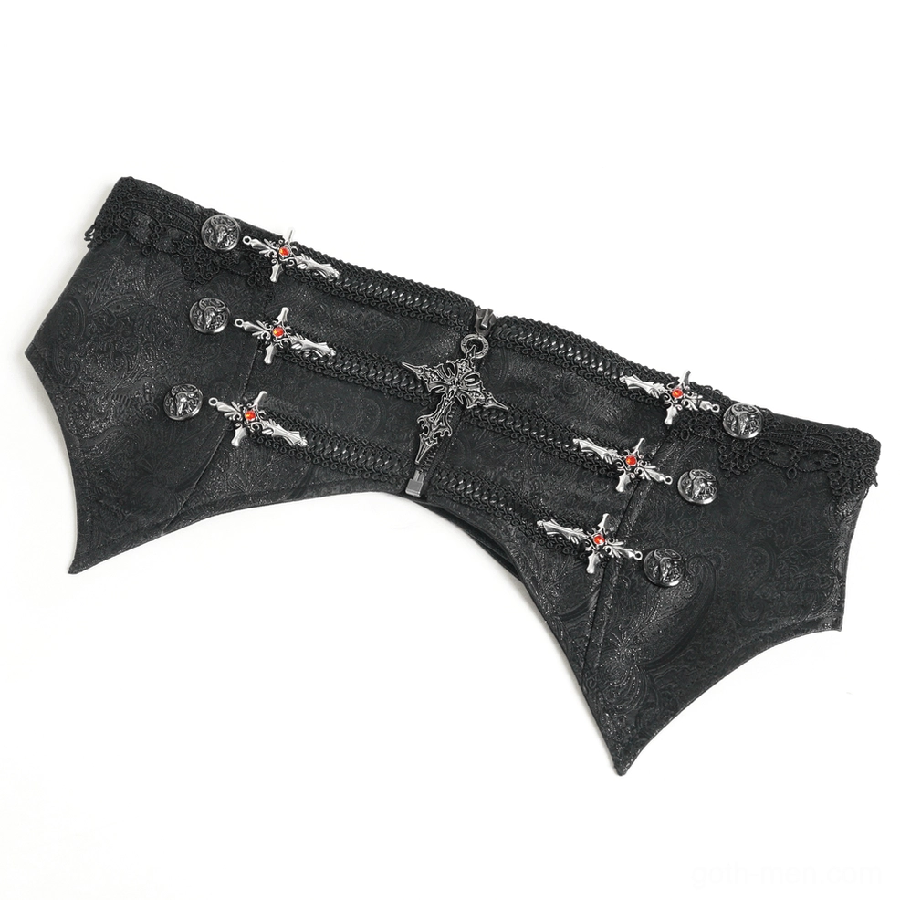 Top-down flat lay of black brocade gothic corset displaying cross and round metal ornaments on matte faux leather