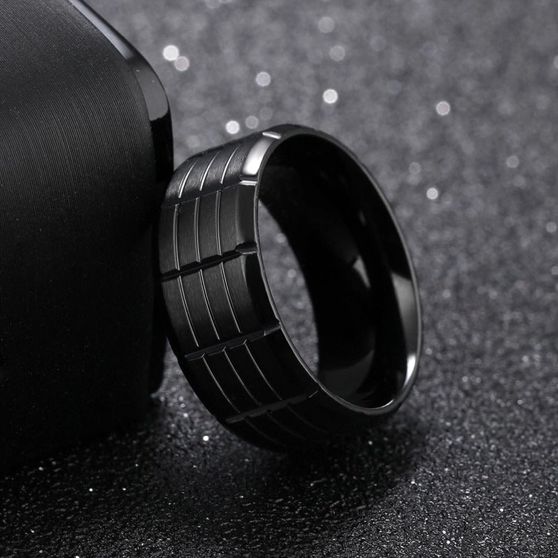 Black stainless steel gothic grid ring oblique angle showing geometric engraving