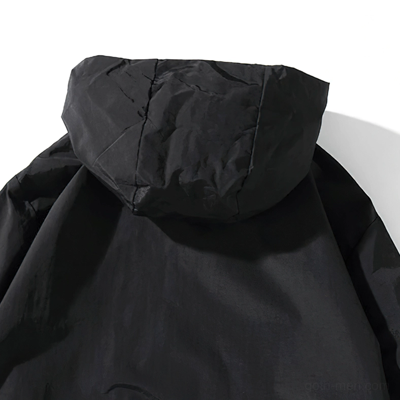 Model wearing black oversized gothic hoodie demonstrating versatile alternative fashion styling