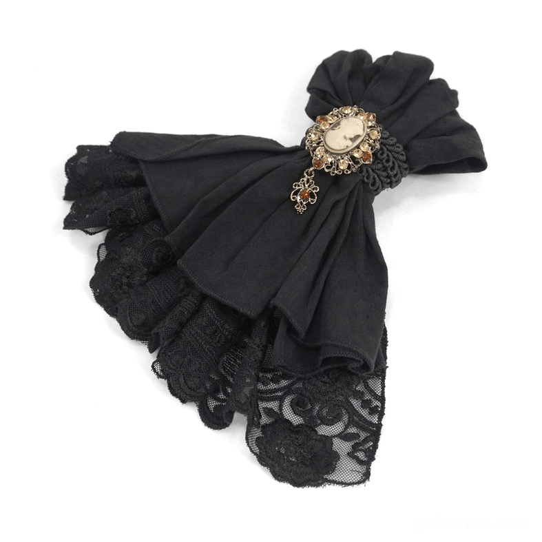 Black gothic lace jabot necktie flat lay with vintage oval cameo brooch and crystal accents on white background