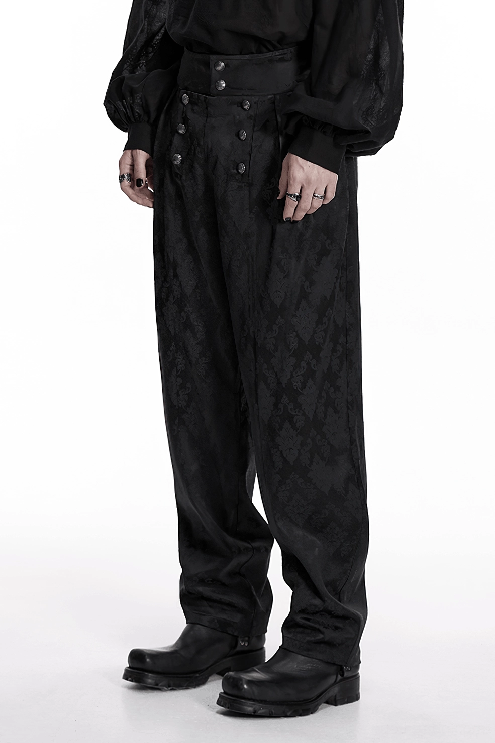 Black gothic jacquard tapered trousers fabric texture showing intricate jacquard weave and pattern