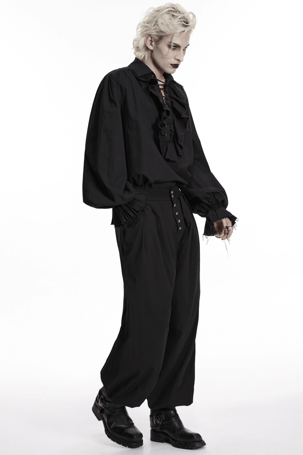 Black gothic pleated lantern pants side studio view, showing structured silhouette and volume proportion of wide leg design