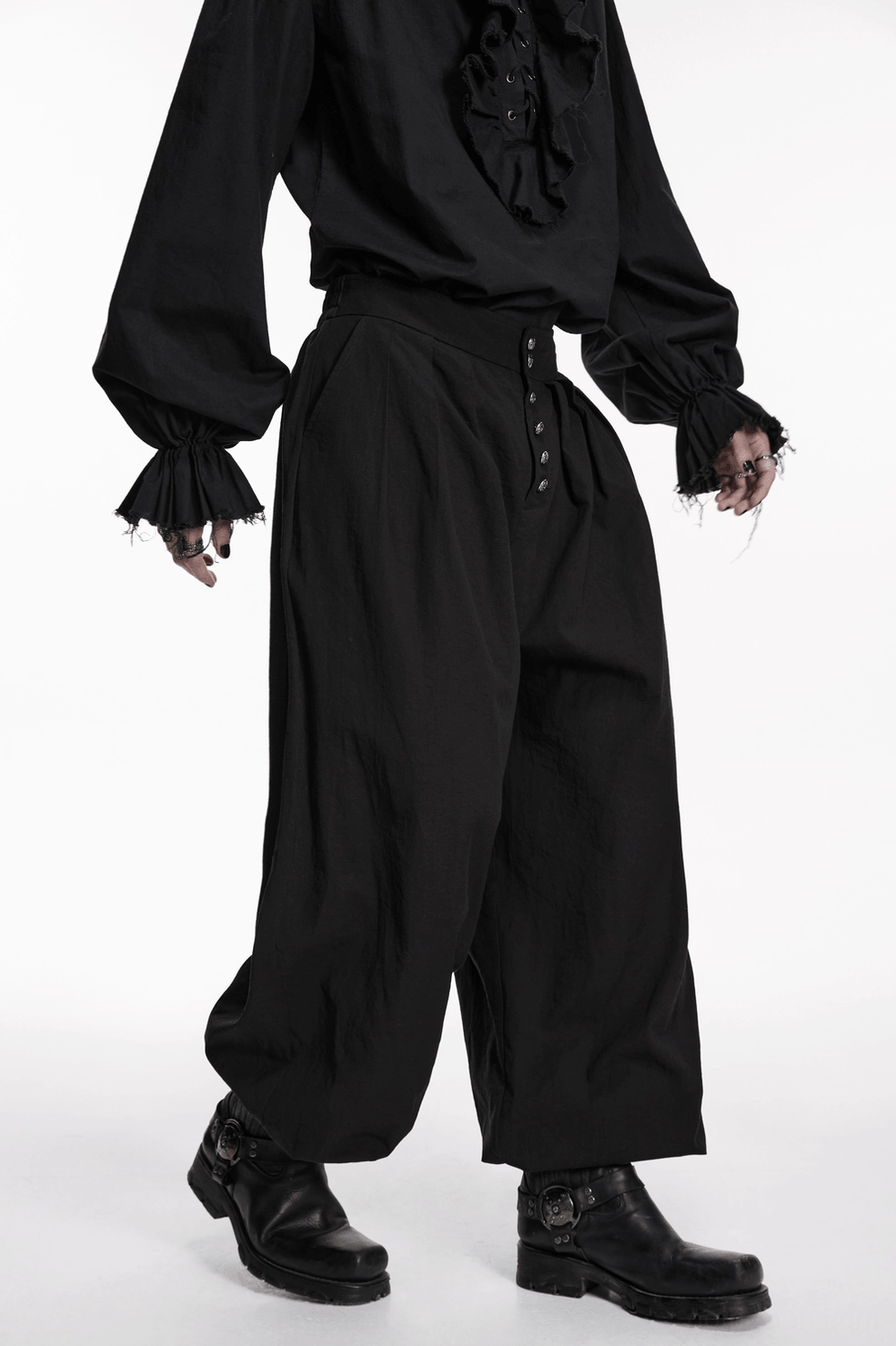 Black gothic pleated lantern pants alternate studio angle, emphasizing dramatic volume and tapered leg proportions