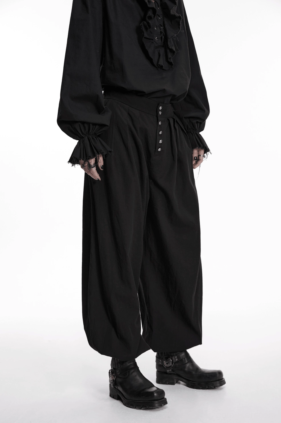 Black gothic tapered pants three-quarter angle studio shot, displaying silhouette and pleated design on neutral background