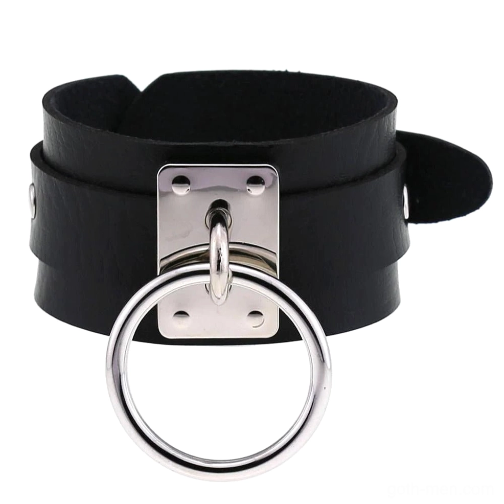 Classic black leather gothic cuff bracelet with silver metal rings, dual-strap design, flat lay overhead view