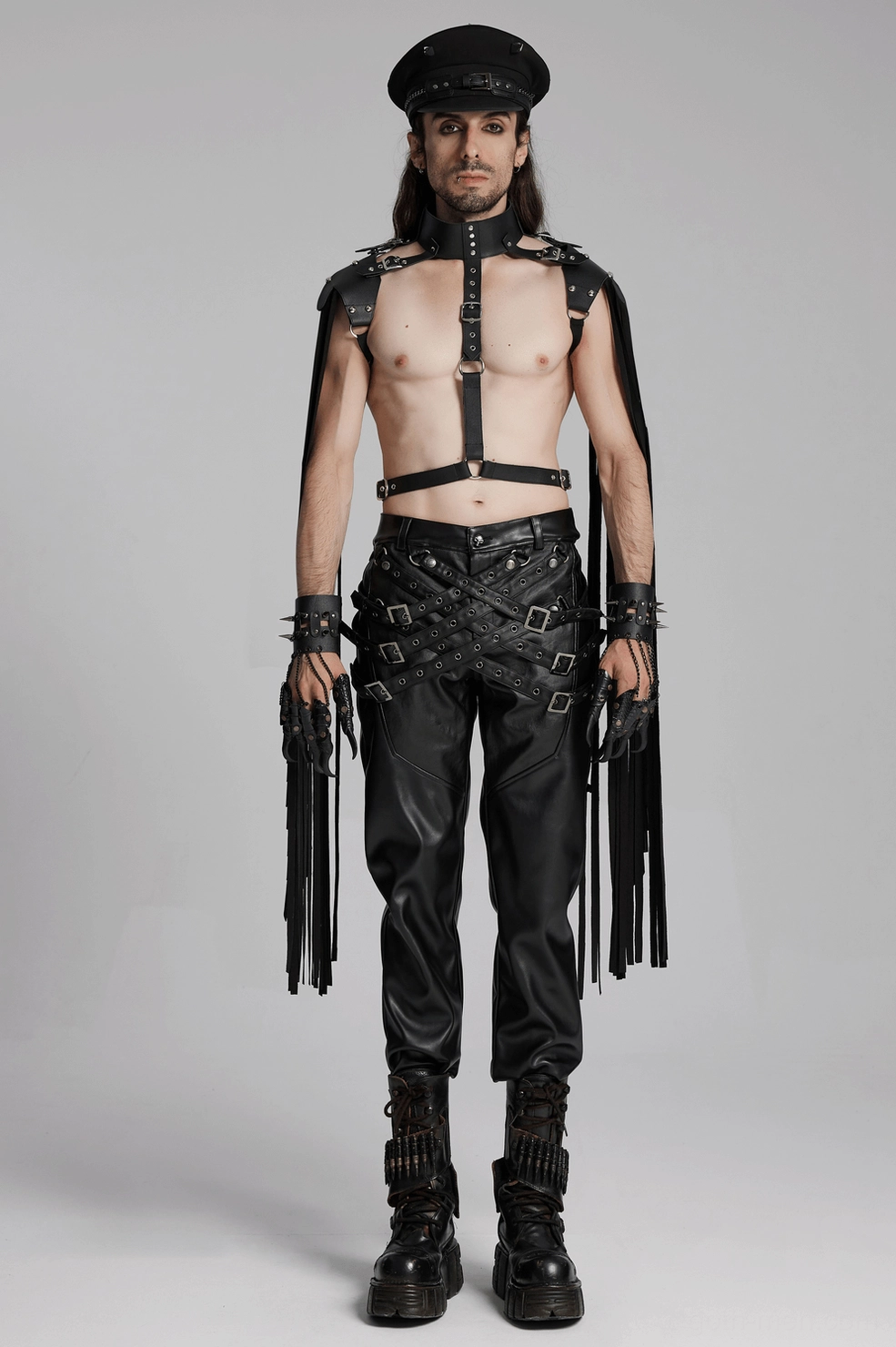 Full length back view of black gothic leather pants with adjustable straps and metal accents