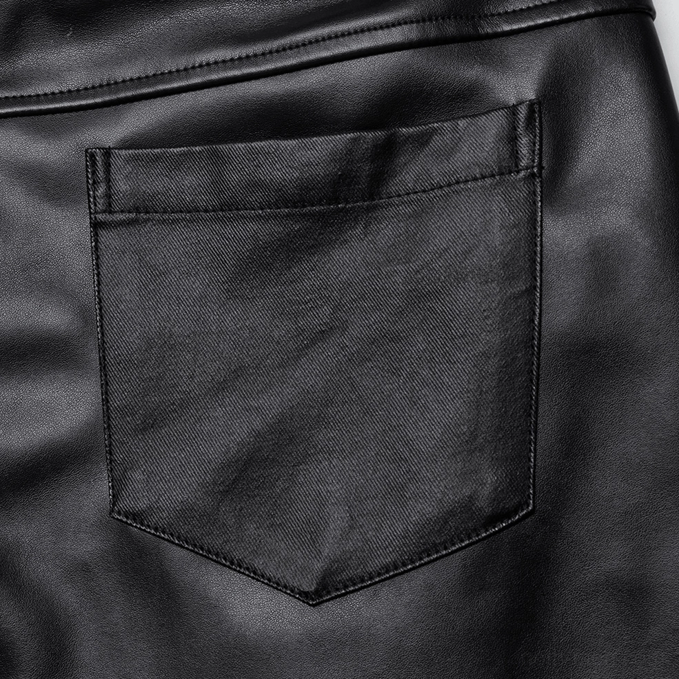 PU leather gothic pants showing texture and sheen of faux leather material with metal hardware