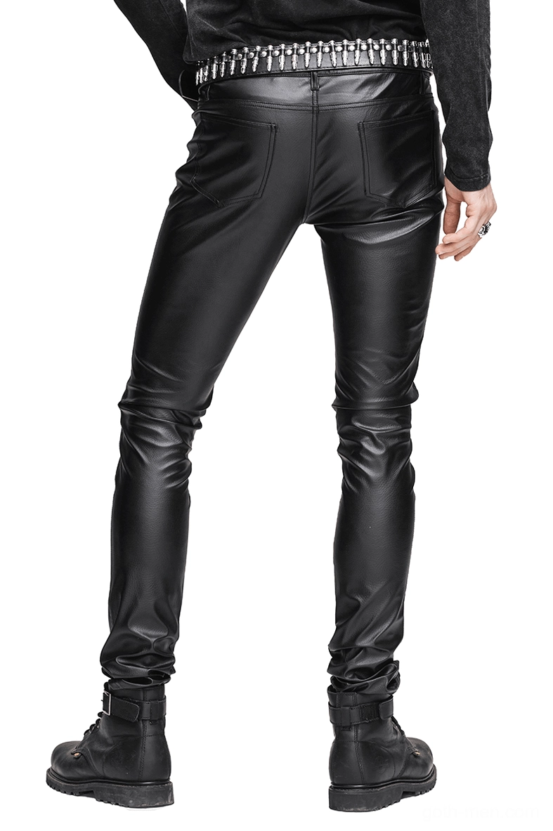 Rear full-length view of black gothic slim-fit PU leather pants showing tight silhouette and studded belt on male model against white background