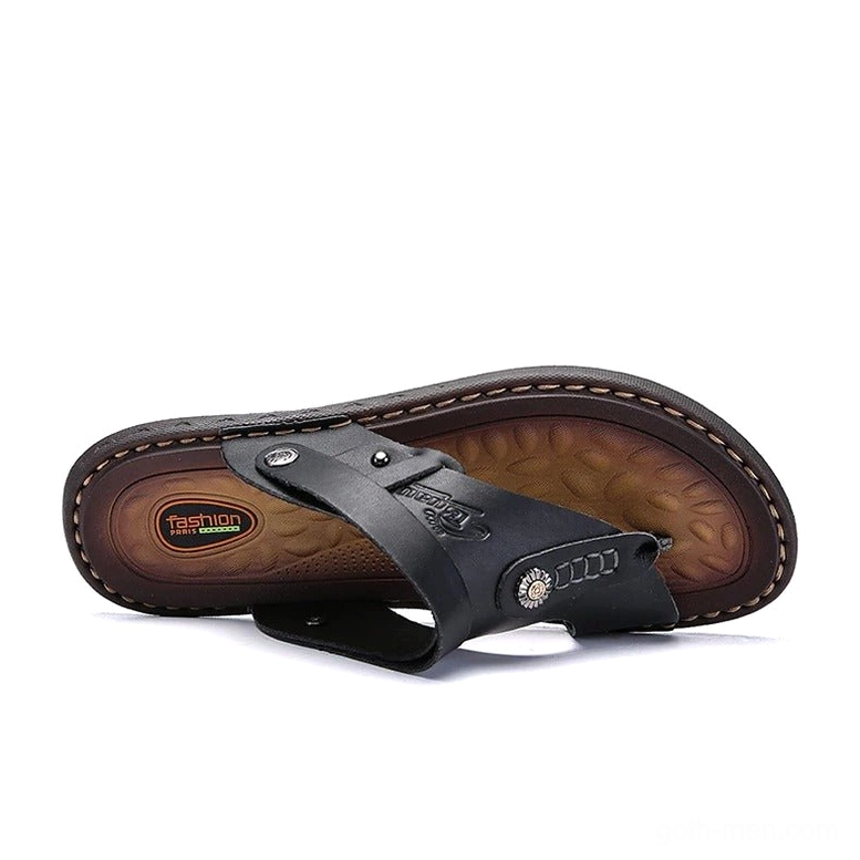 Black gothic microfiber sandals bottom view showing branded insole and stitched rubber outsole