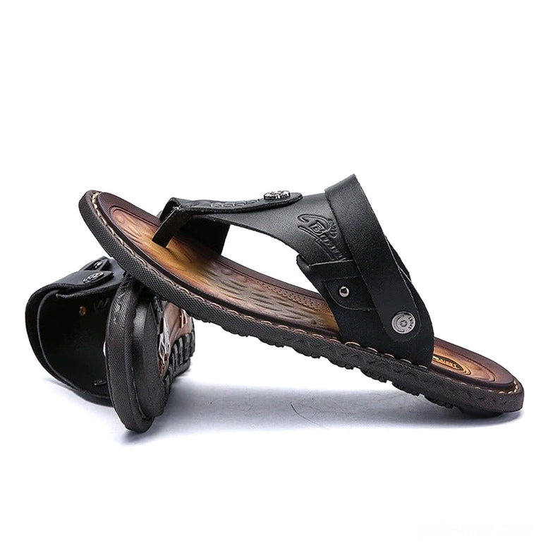 Black alternative fashion microfiber sandals stacked display with embossed logo - low angle view