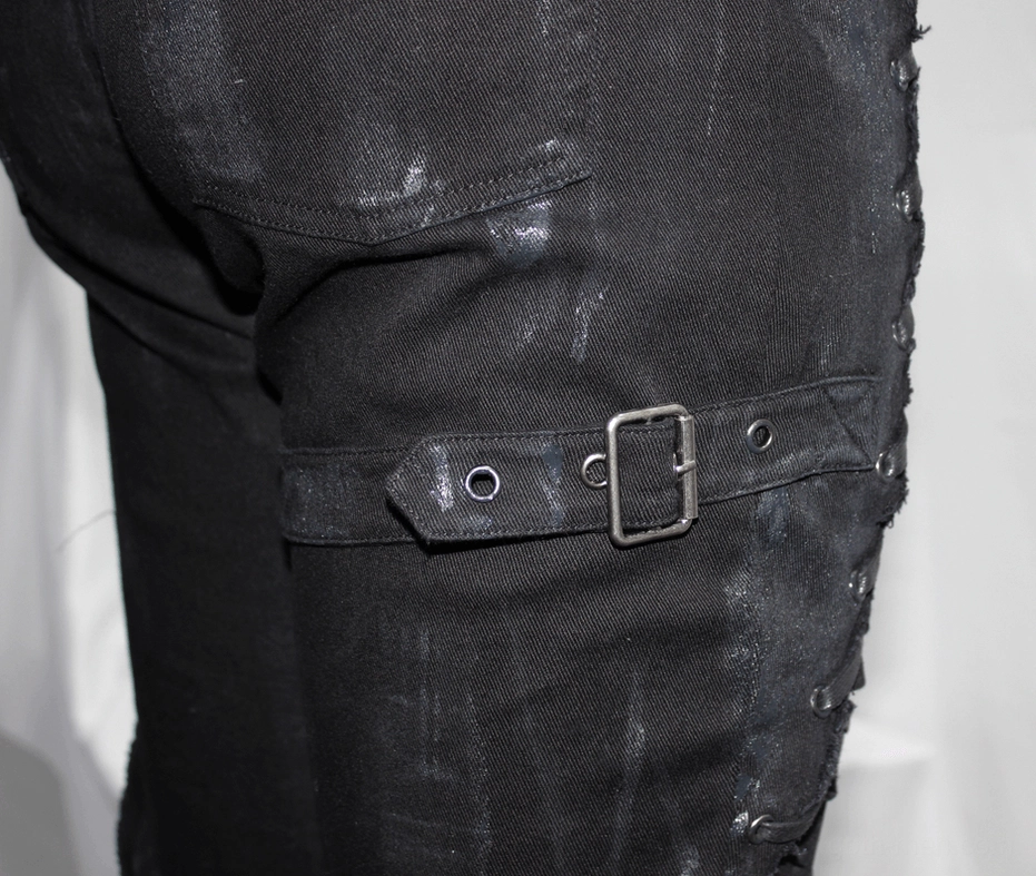 Full-length front perspective of black gothic slim-fit lace-up pants on male model in studio