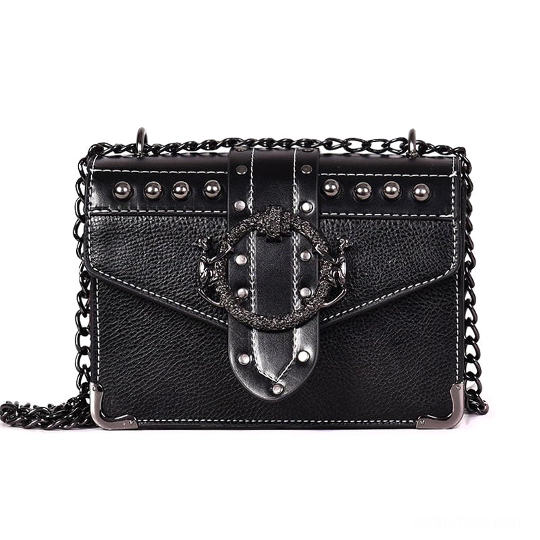 Black gothic square shoulder bag with skull rivet embellishments and ornate metal lock clasp, front view flat lay