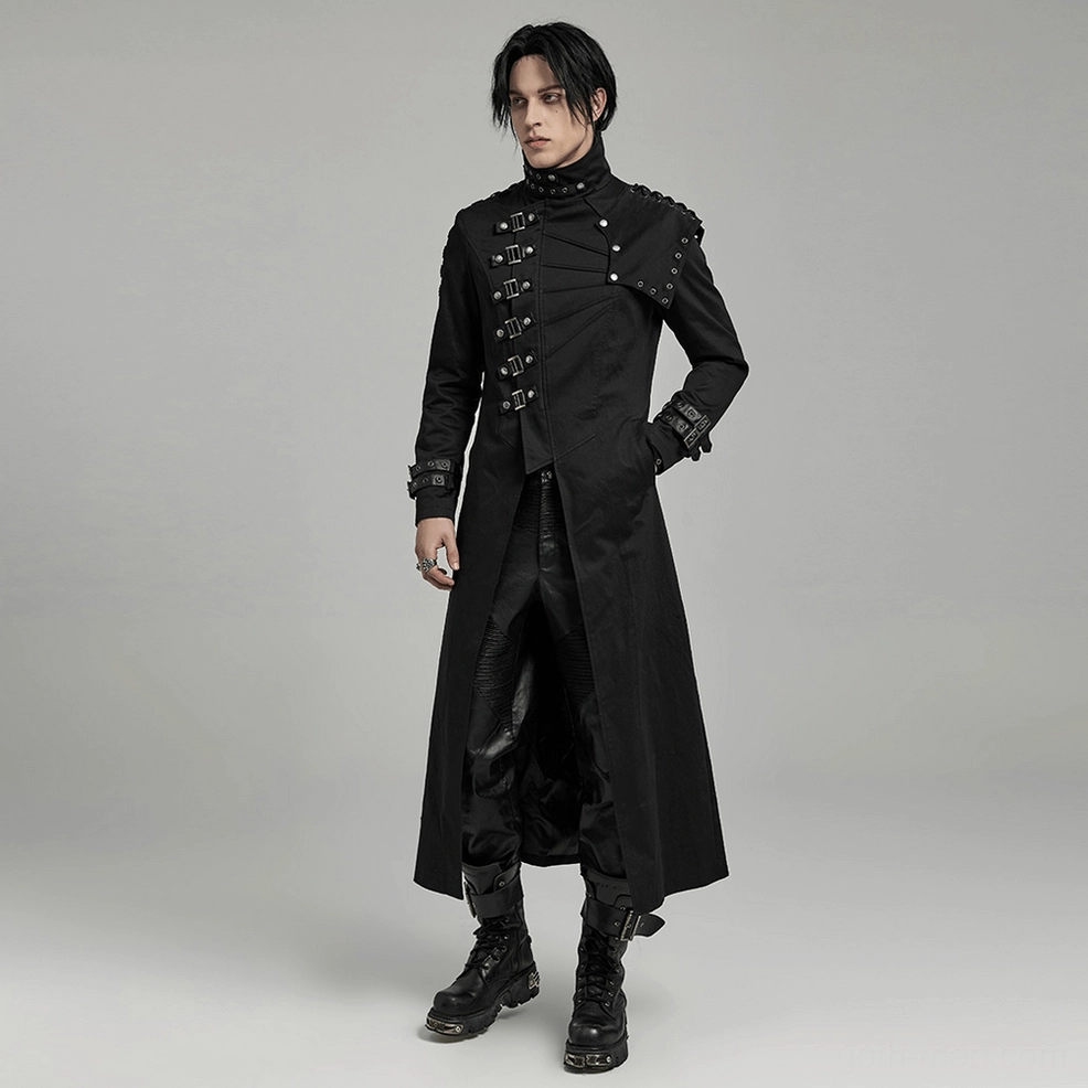 Three-quarter front view of black gothic asymmetrical trench coat with hand in pocket