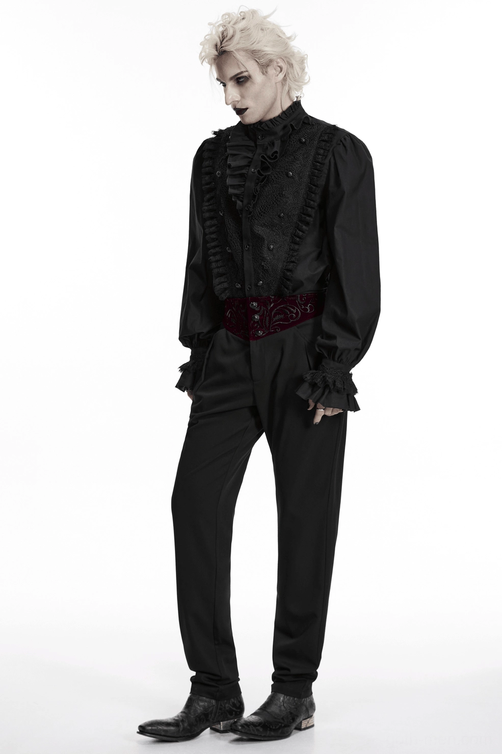 Male model wearing black gothic trousers with embroidered velvet waist paired with formal top