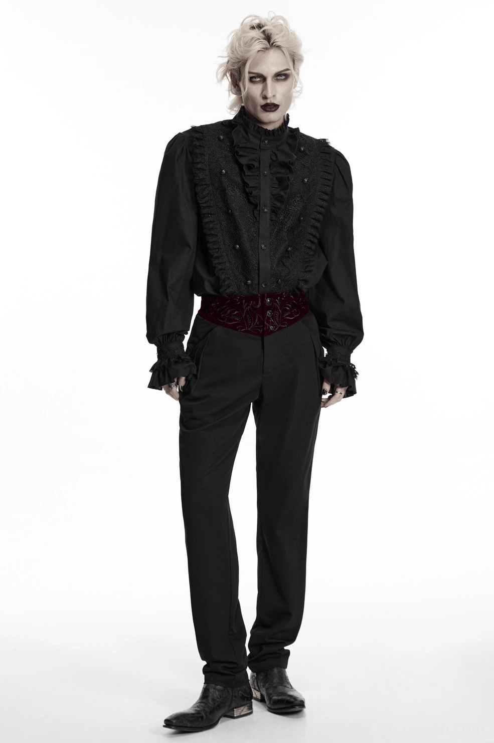 Three-quarter view of black gothic trousers showing embroidered waistband and tailored cut