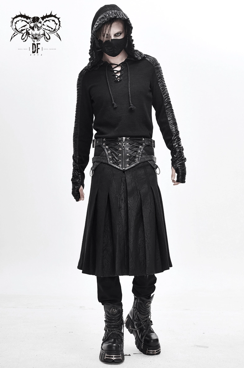Close-up of asymmetric kilt hem and pleated fabric showing the diagonal cut design detail