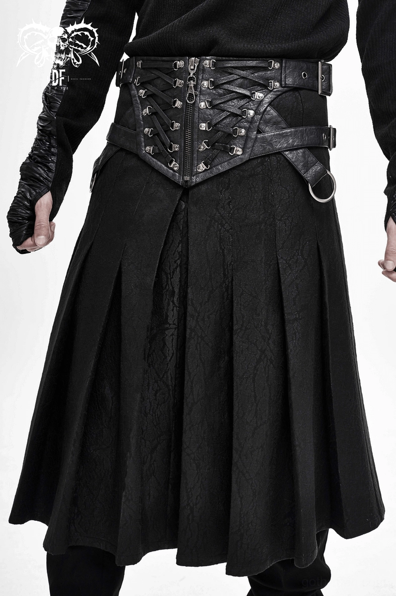 Asymmetric black kilt skirt layered styling with harness and festival fashion accessories