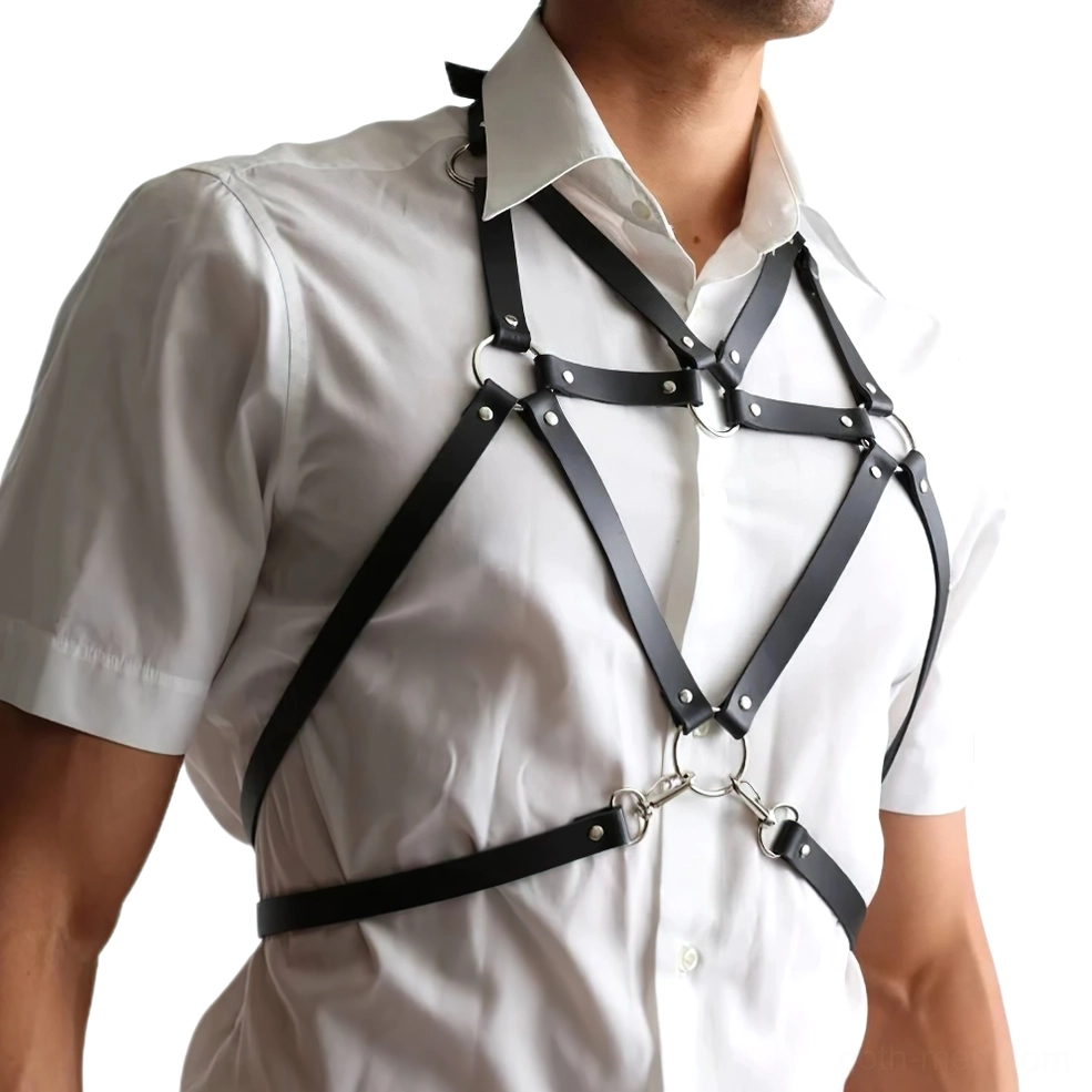 Black leather bondage harness with crisscross hardware straps over shirtless male model