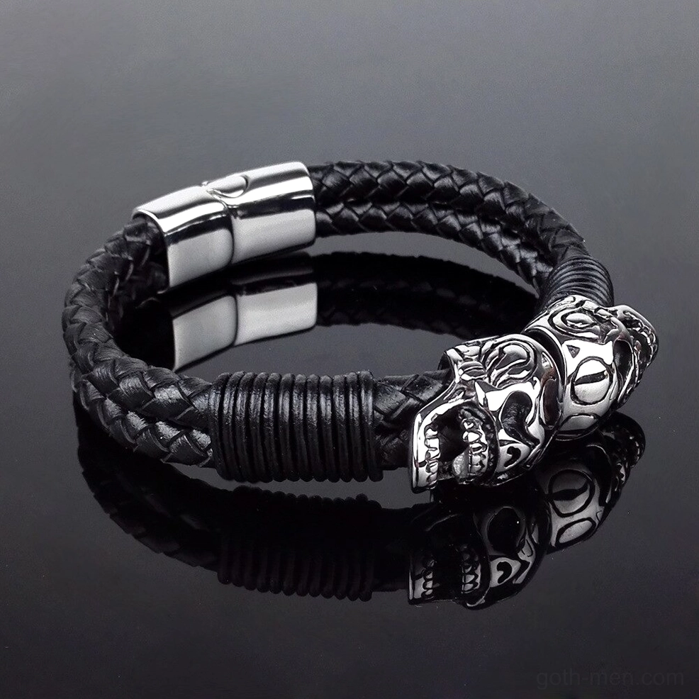 Side angle view of braided leather bracelet with single skull stainless steel accent