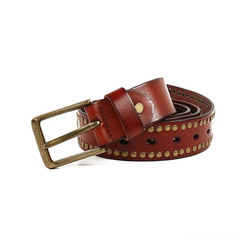 Black leather gothic belt with geometric bronze rivet pattern, flat lay display