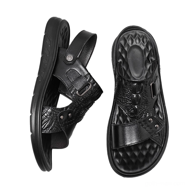 Black leather sandals flat lay overhead view revealing quilted insole design and dual-wear functionality