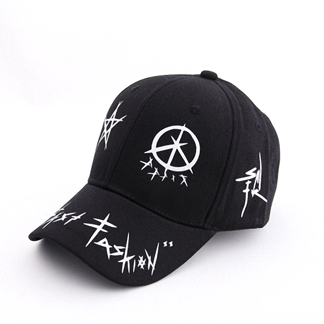Black gothic graffiti snapback cap showing white punk letter prints and anarchist symbolism, three-quarter side view