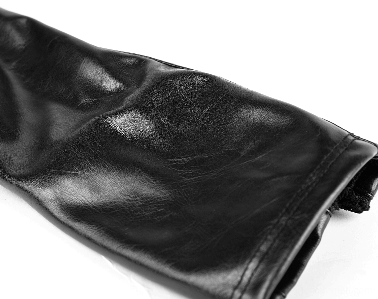 Flat texture detail of matte black leather cuff with elasticated edge on gothic gauntlet glove
