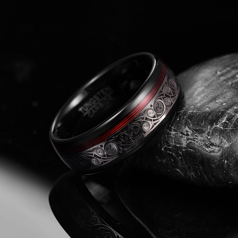 Black tungsten steel gothic ring with polished glossy surface and inner engraved text detail, low side view with stone prop