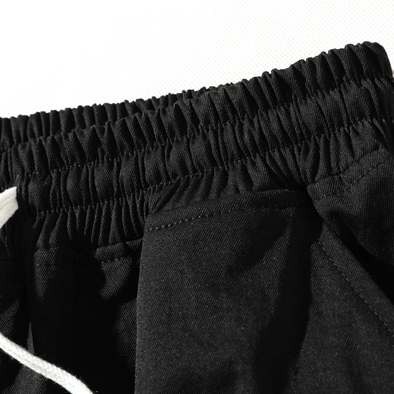 Multi-pocket utility shorts in black with drawstring waist - alternative fashion styling