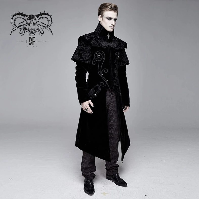 Black velvet gothic coat textural detail showing damask weave pattern and premium fabric quality on mannequin